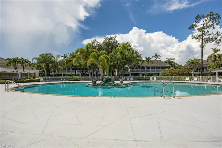 Community pool featuring a patio area