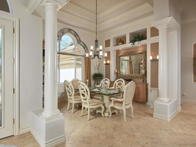 Beautiful Dining Room with built-in cabinetry, custom mirror and fabulous arched window