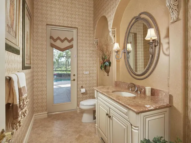 Lovely powder room adjacent to the pool...no wet bathing suits beyond this point!!! Lanai has outdoor shower!