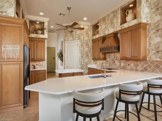 Kitchen has new counter height quartz countertops and sink.  Although an electric cooktop, there is natural gas to this home and easily converted.  Large walk-in pantry