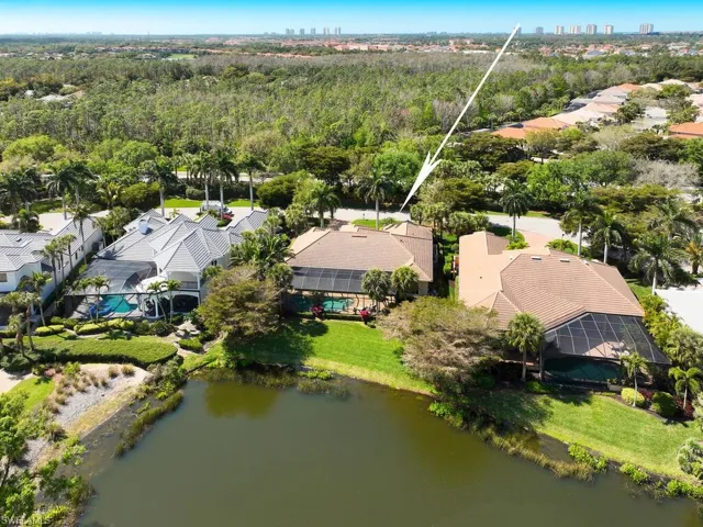 Drone view from lake looking west toward house.