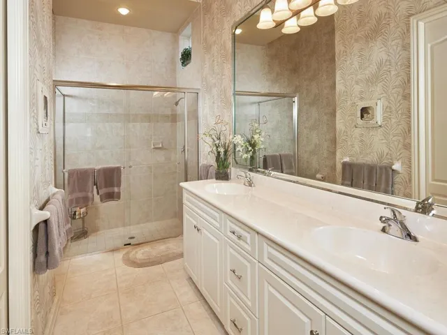 Large guest bath with dual sinks and walk-in shower
