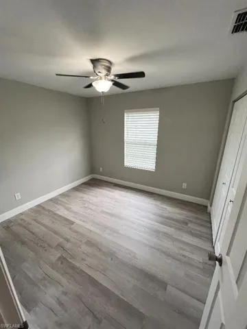 Unfurnished room featuring ceiling fan and light hardwood / wood-style floors