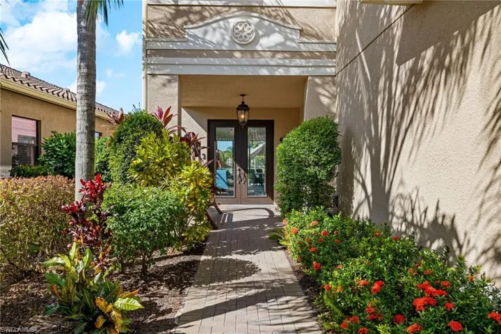 Property entrance featuring Dual French hurricane doors and area for sitting.