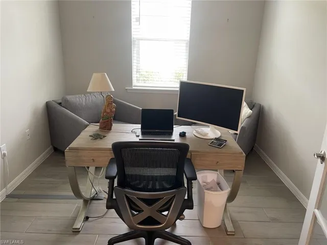 Office space featuring light wood-type flooring