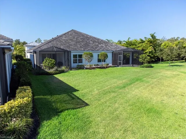 View of yard featuring glass enclosure