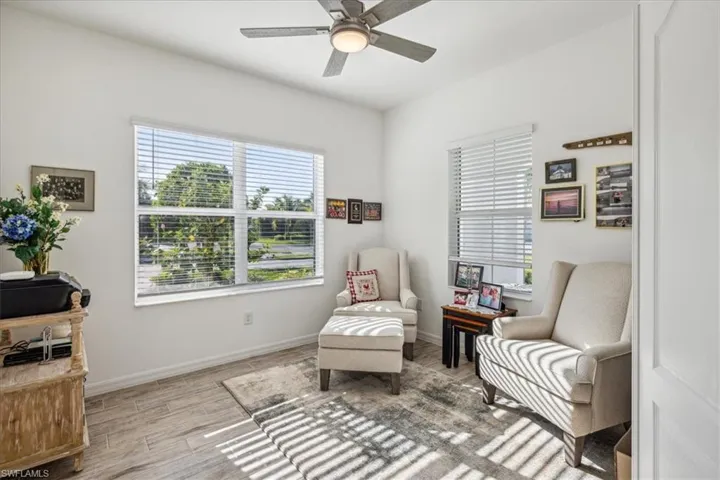 Living area featuring ceiling fan and light hardwood / wood-style flooring