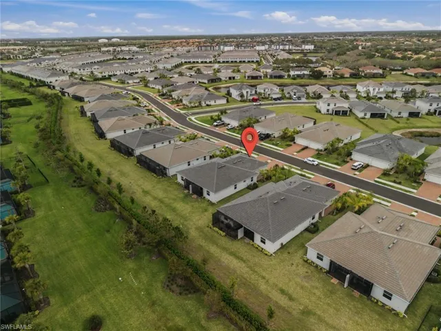 Aerial overview of property's location with nearby suburban area