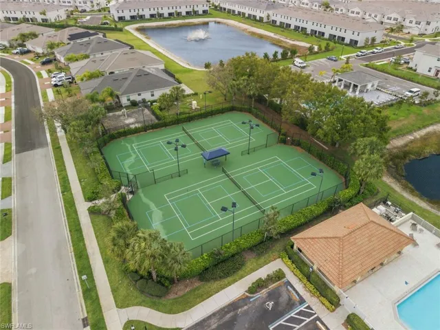 Aerial perspective of suburban area with a nearby body of water