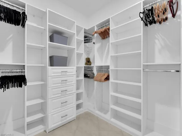 Primary Walk-In Closet with Custom Organizers