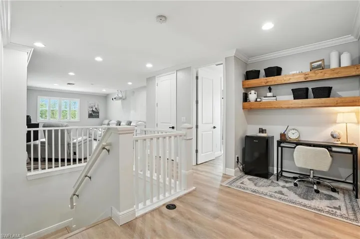 Office space with wood finished floors, recessed lighting, and ornamental molding