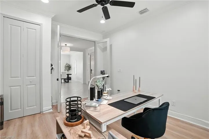 Office space featuring ceiling fan, light wood finished floors, crown molding, and recessed lighting