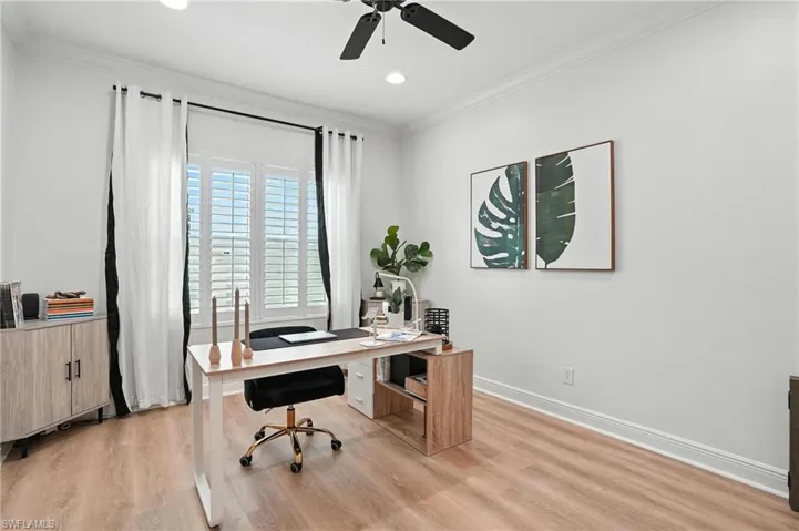 Office with crown molding, light wood-type flooring, a ceiling fan, and recessed lighting
