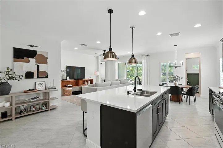 Kitchen featuring a chandelier, recessed lighting, ornamental molding, dishwasher, and hanging light fixtures