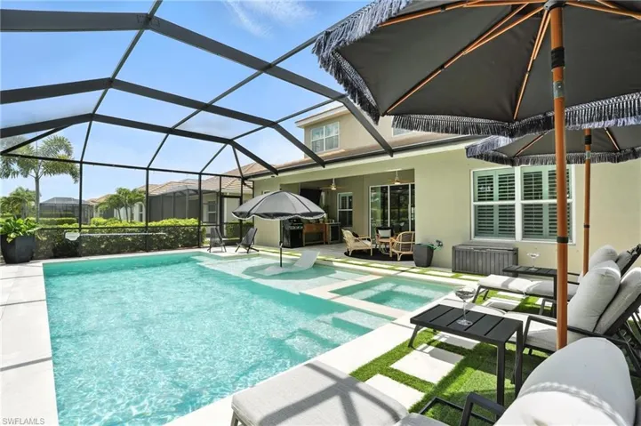 Swimming pool with a patio area, ceiling fan, and an outdoor hangout area