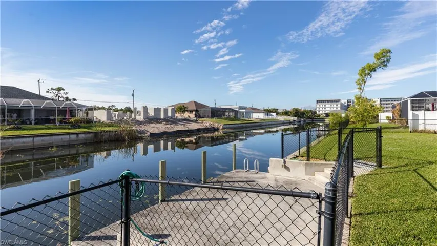 Dock with water available and fenced yard