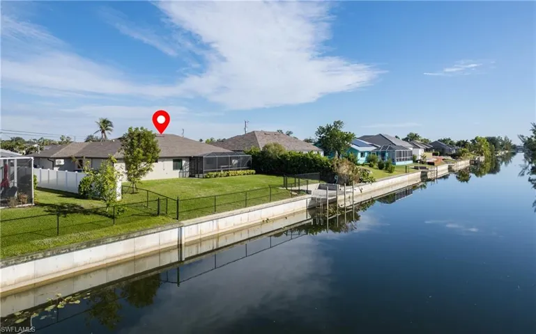 Rear view of property with canal