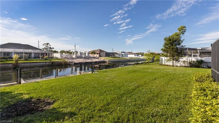 View of yard with a water view