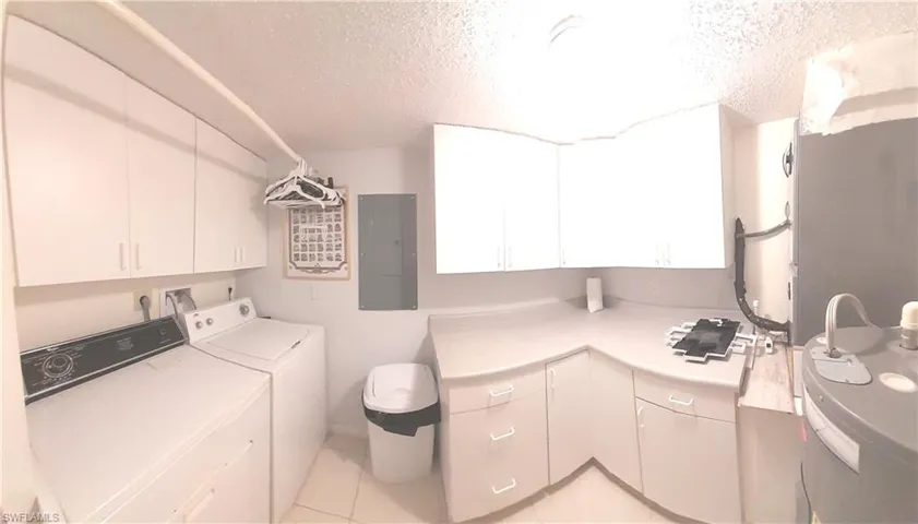 Laundry room with built-in cabinets