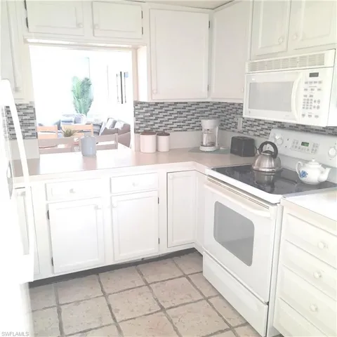Kitchen to dining room -- plenty of storage