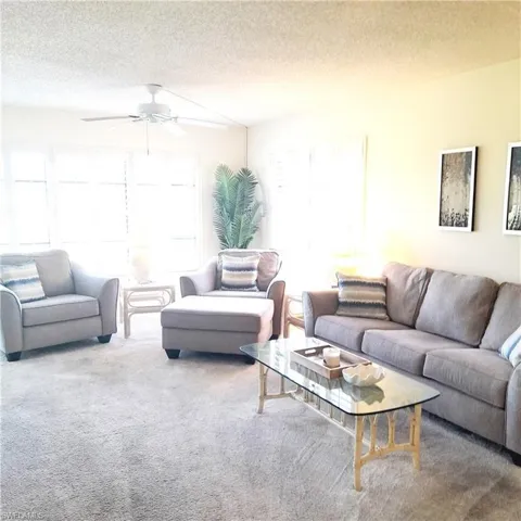 Comfortable living room with golf course view