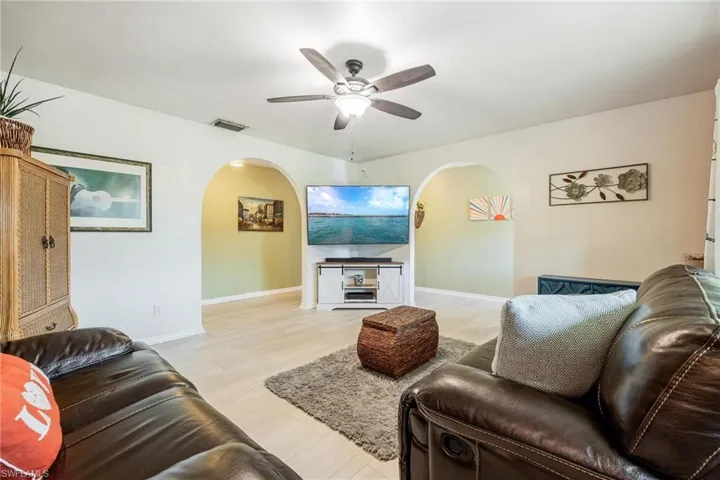 Living room with light wood-type vinyl flooring