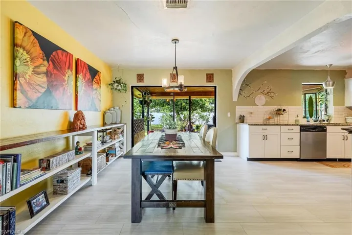 Dining room featuring plenty of natural light and a notable chandelier