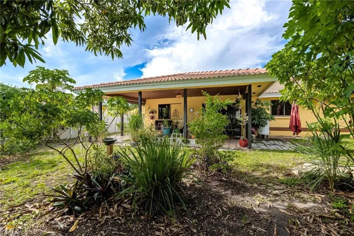 Rear view of house featuring a patio