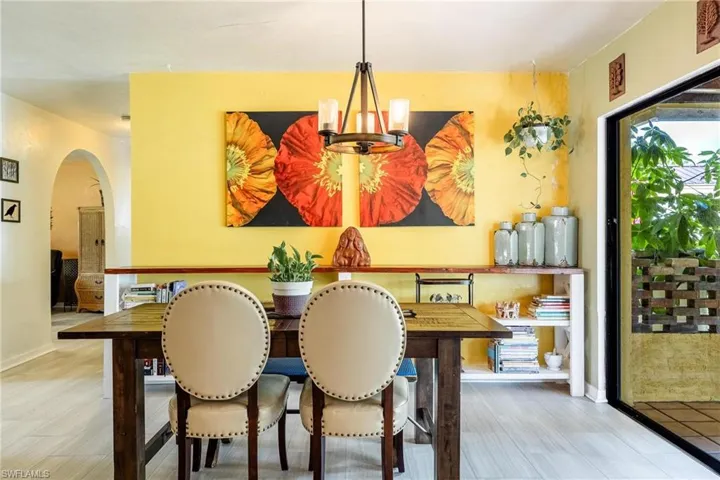 Dining space featuring a chandelier and light hardwood / wood-style floors
