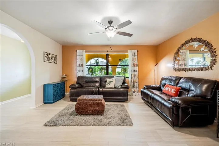 Living room featuring ceiling fan