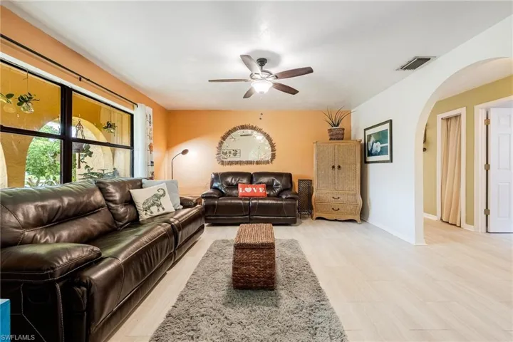 Living room featuring ceiling fan