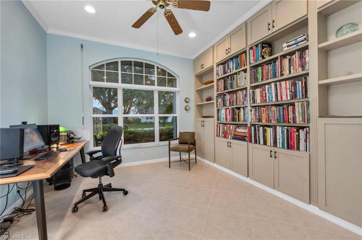 Study with custom built in shelving and great light.