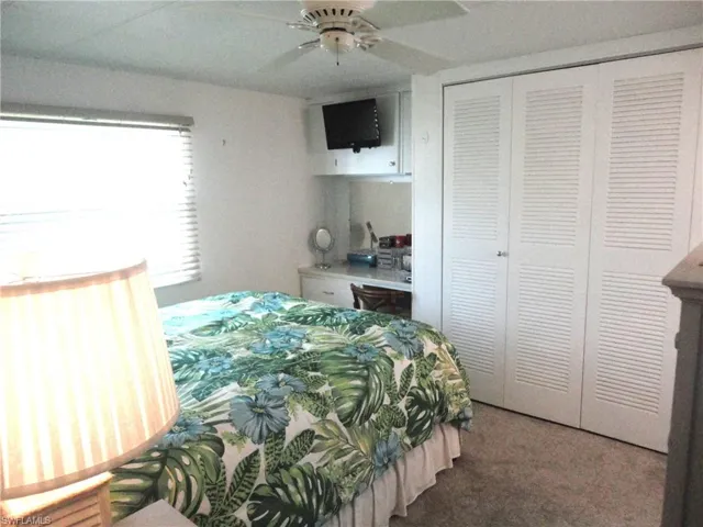 Master Bedroom featuring ceiling fan, a closet, and carpet floors