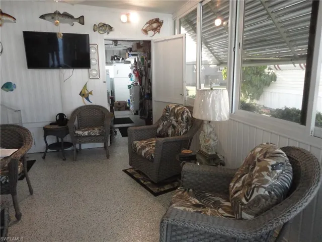 Sunroom / solarium with plenty of natural light and french doors