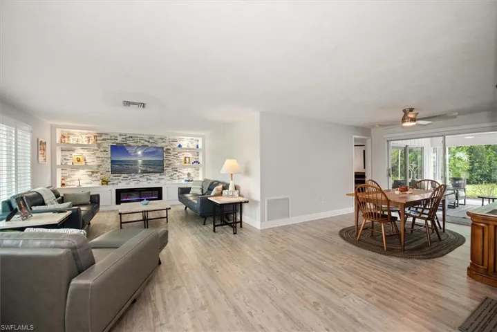 Open-concept living space featuring wood-finish flooring
