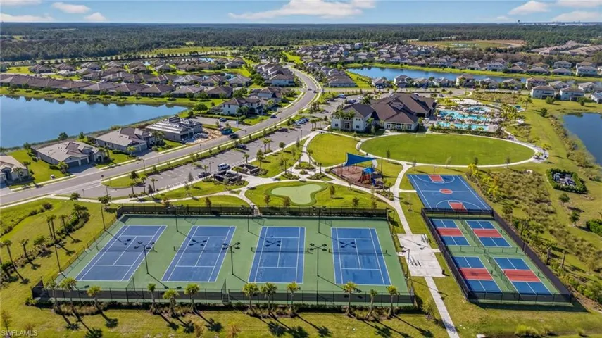 Aerial perspective of suburban area featuring a large body of water