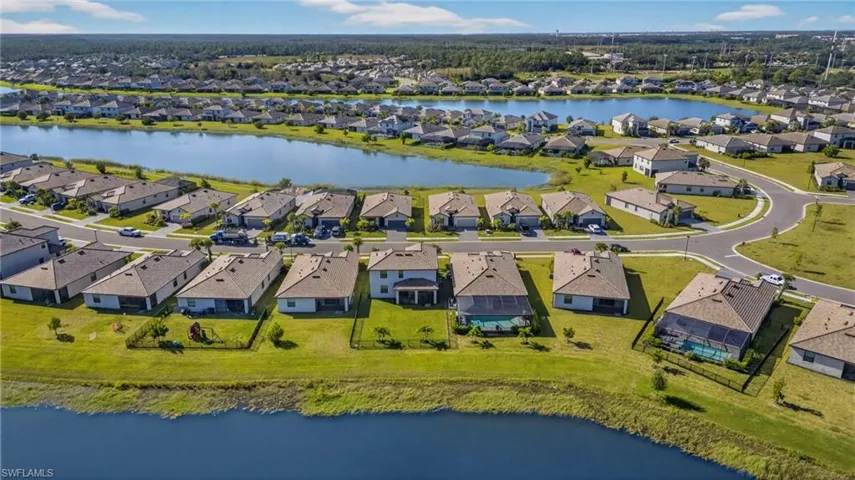 Aerial view of residential area with a nearby body of water