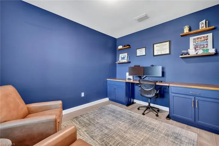 Office with light wood-style flooring