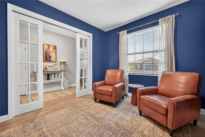 Living area with wood finished floors and french doors