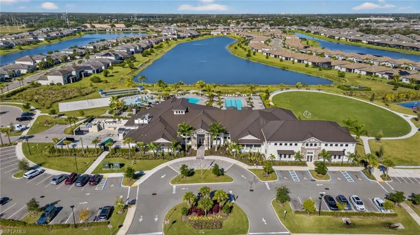 Aerial perspective of suburban area with a nearby body of water