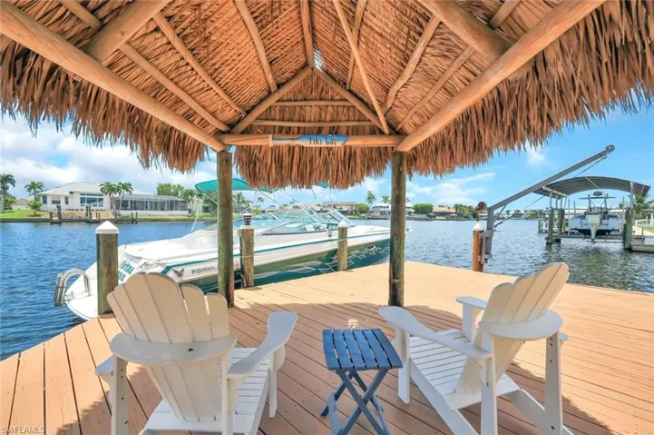 Covered Tiki hut with views either direction of the 200'+ wide canal