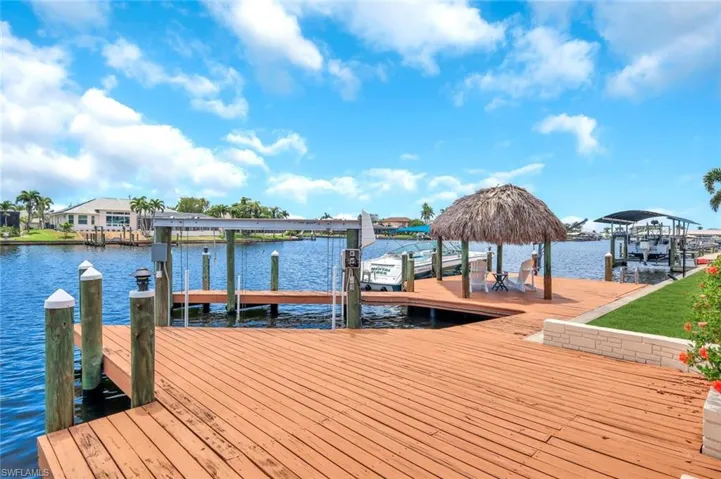 Boat Dock area featuring 10,000 lb boat lift and Tiki Hut