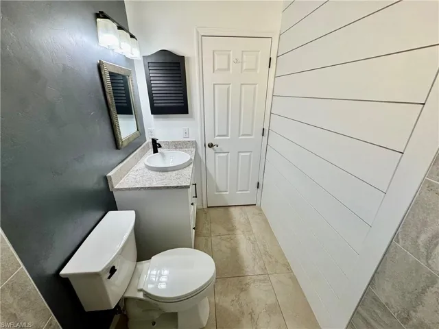 Bathroom featuring vanity and light tile patterned floors