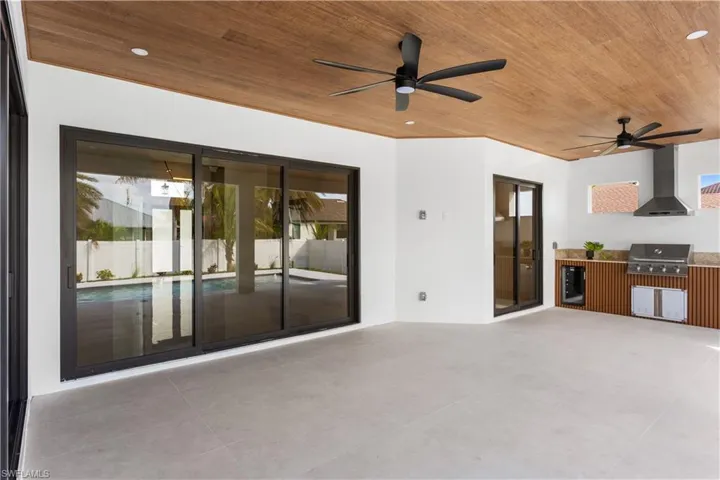 Step outside & experience YOUR PRIVATE OASIS w/ OUTDOOR KITCHEN