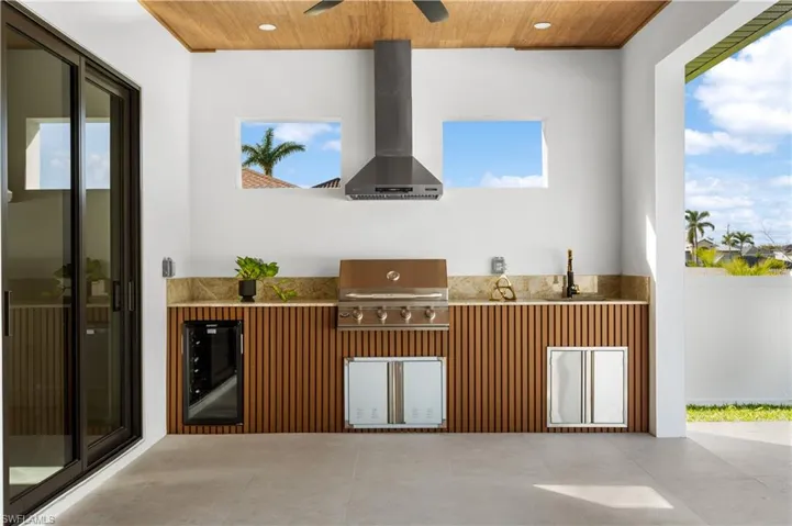 4-BURNER GRILL, HOOD VENT, MINI-FRIDGE, STORAGE SPACE & COMMERCIAL SINK