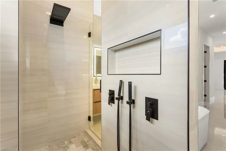 Walkthrough shower with two shower heads and hand-held showers!