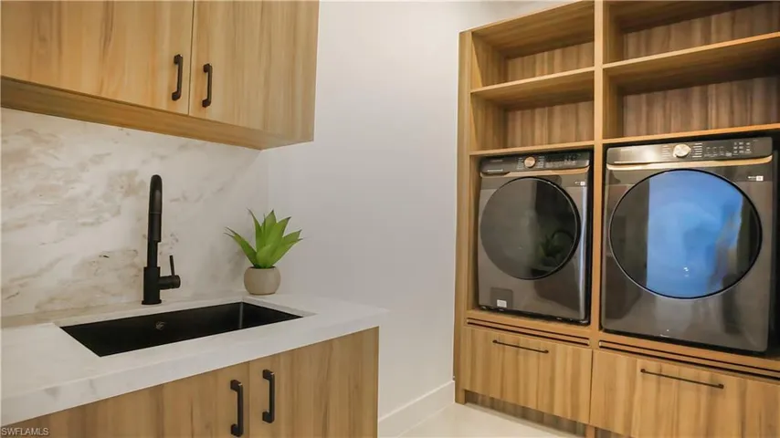 LAUNDRY features SAMSUNG SMART WASHER & DRYER, BUILT-IN CABINETS & LAUNDRY TUB.