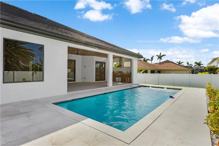 PERFECT for ALFRESCO DINING after SWIMMING surrounded by LUSH LANDSCAPING in SWFL PARADISE!