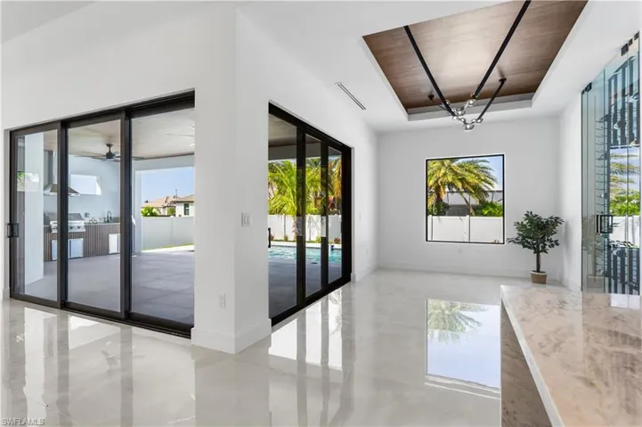 This stunning dining room features elegant finishes, spacious layout, and large windows that flood the space with natural light. Perfect for entertaining, it combines style and functionality with a sophisticated atmosphere.