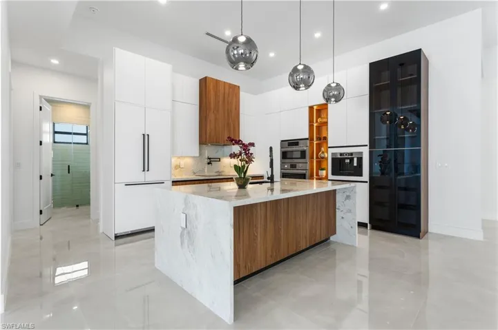 This gourmet kitchen is perfect for culinary enthusiasts and ideal for both cooking and entertaining! Seating area at the kitchen island, complemented by under-island cabinets for additional storage.